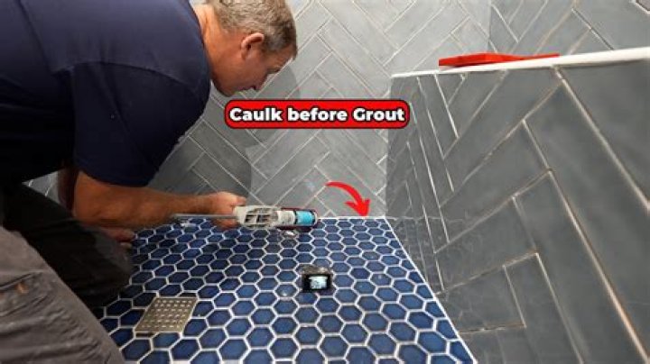 Can you calk over grout?